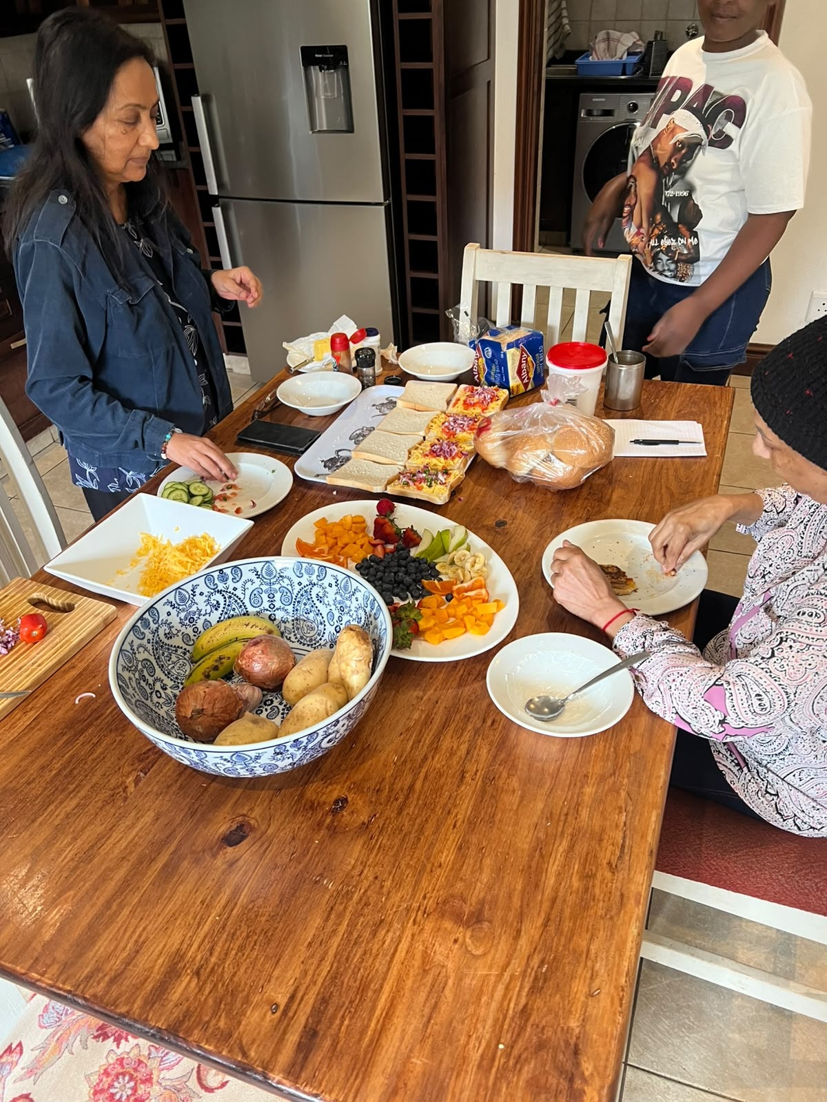 Family gathering around a colourful meal